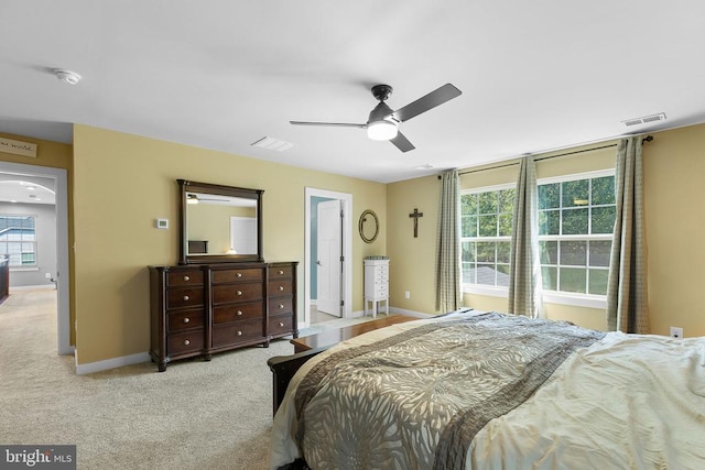  - carpeted bedroom with baseboards and a ceiling fan