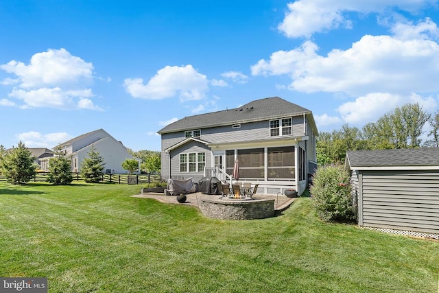  - back of property featuring a patio area, a sunroom, and a storage unit