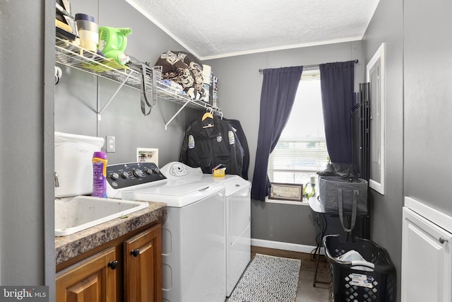 4253 Rolling Hills Dr, Culpeper, VA 22701 - laundry room with washing machine and clothes dryer, a textured ceiling, and wood finished floors