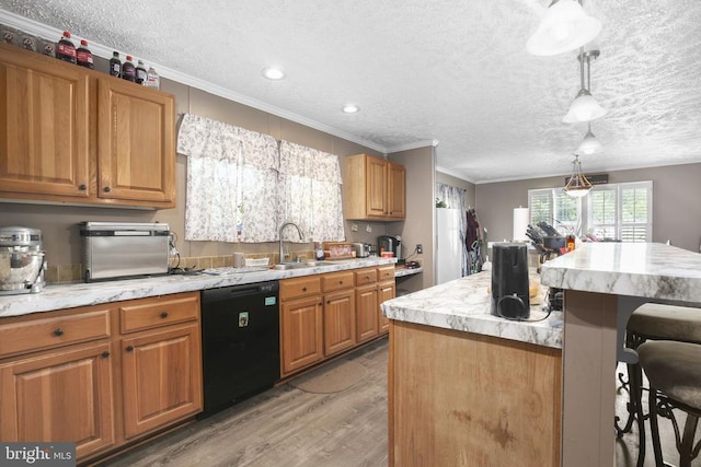 4253 Rolling Hills Dr, Culpeper, VA 22701 - kitchen with black dishwasher, a kitchen bar, crown molding, light wood-style floors, and a textured ceiling