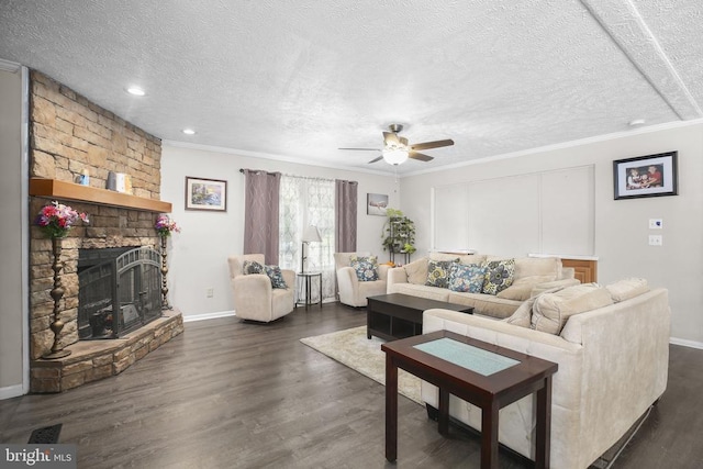 4253 Rolling Hills Dr, Culpeper, VA 22701 - living room featuring a textured ceiling, a stone fireplace, dark wood-type flooring, a ceiling fan, and ornamental molding