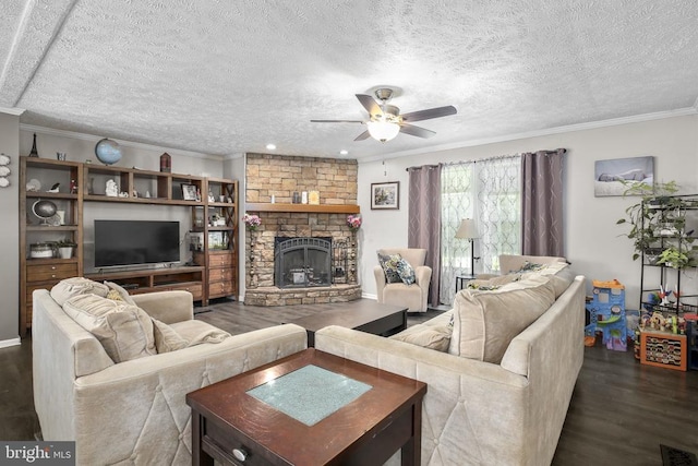 4253 Rolling Hills Dr, Culpeper, VA 22701 - living room featuring dark wood-style flooring, a ceiling fan, ornamental molding, a stone fireplace, and a textured ceiling