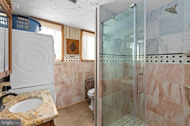 41 Carr Cir, Mineral, VA 23117 - full bathroom with a stall shower, tile walls, vanity, and toilet