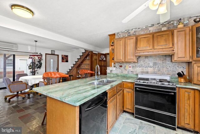 41 Carr Cir, Mineral, VA 23117 - kitchen with black appliances, a sink, light stone finish flooring, a peninsula, and decorative backsplash