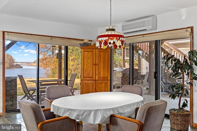 41 Carr Cir, Mineral, VA 23117 - dining room featuring a wall mounted AC, a water view, and stone tile flooring