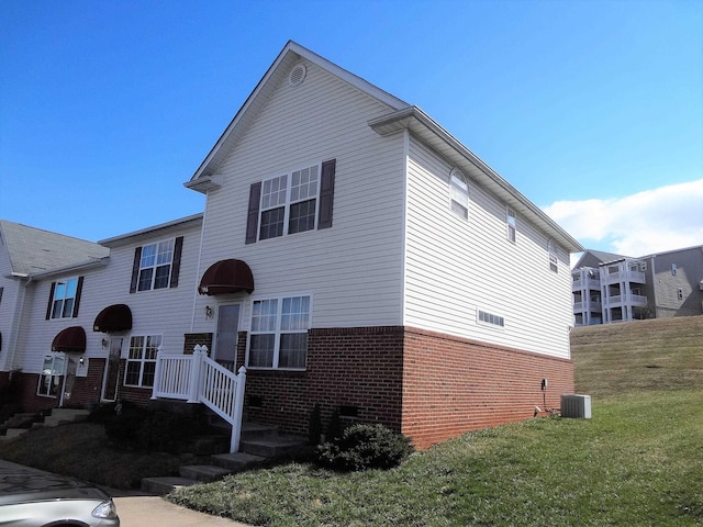 196 Emerson Ln, Harrisonburg, VA 22801 - view of front of property featuring brick siding, a front lawn, and crawl space