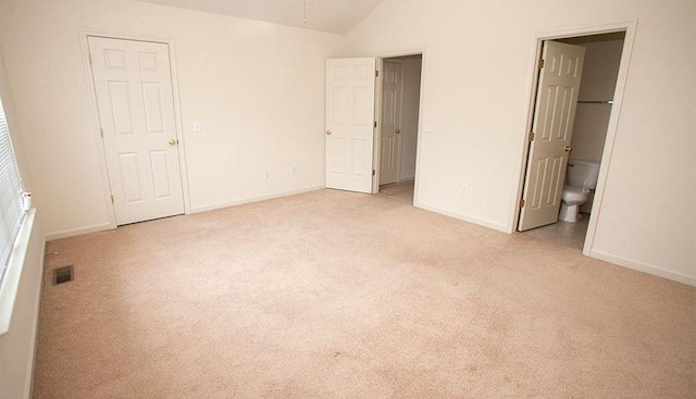 196 Emerson Ln, Harrisonburg, VA 22801 - unfurnished bedroom with light carpet, baseboards, lofted ceiling, and ensuite bath