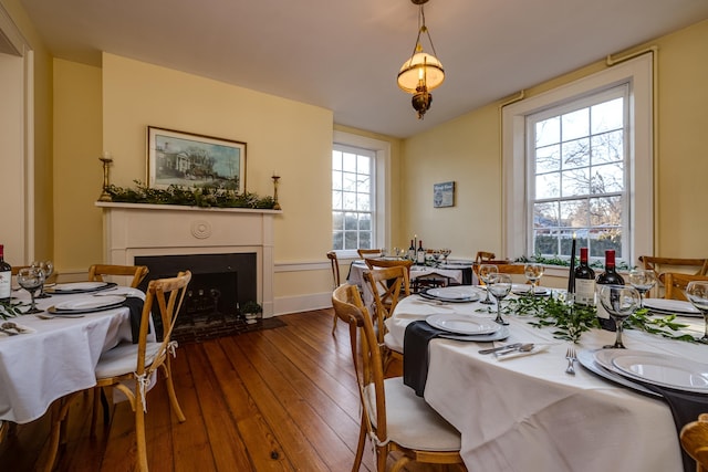 111 Main St S, Bridgewater, VA 22812 - dining room with a fireplace with flush hearth, dark wood-style floors, and baseboards