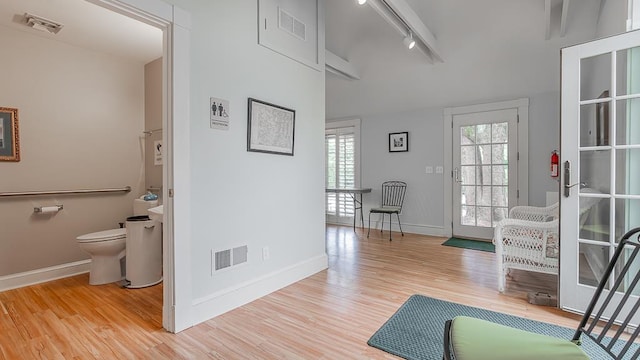 111 Main St S, Bridgewater, VA 22812 - corridor with baseboards, light wood-style flooring, and track lighting