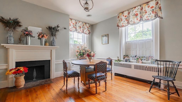 111 Main St S, Bridgewater, VA 22812 - dining room featuring wood-type flooring, radiator, and a fireplace