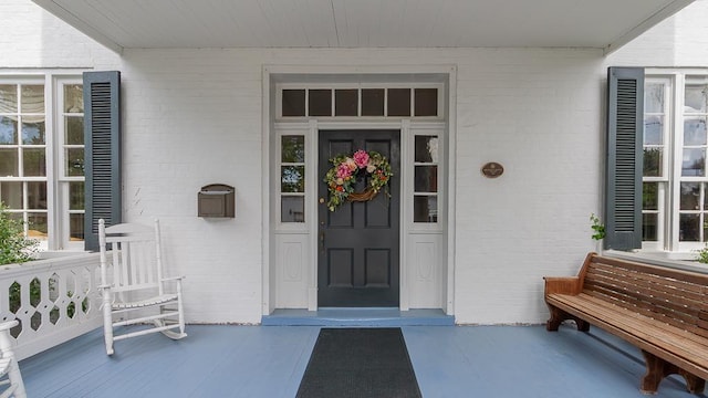 111 Main St S, Bridgewater, VA 22812 - view of exterior entry featuring brick siding and covered porch