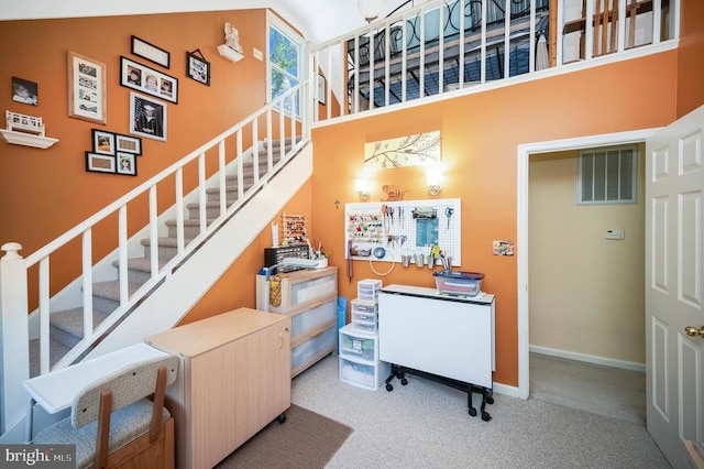 10415 Shaw Dr, Spotsylvania, VA 22553 - stairway featuring carpet and a towering ceiling