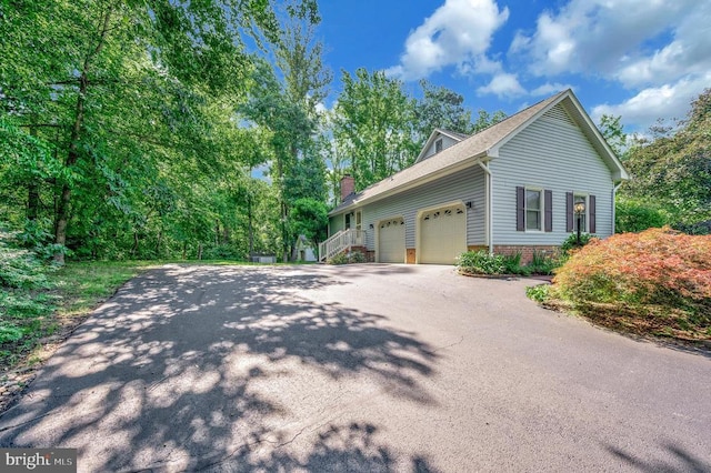 10415 Shaw Dr, Spotsylvania, VA 22553 - view of home's exterior featuring a garage and asphalt driveway