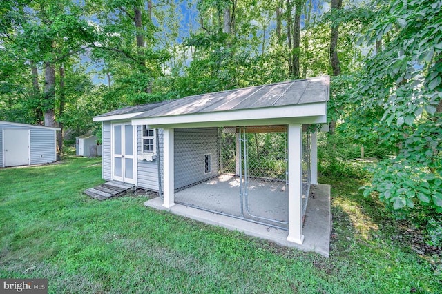 10415 Shaw Dr, Spotsylvania, VA 22553 - view of shed featuring a carport and view of scattered trees