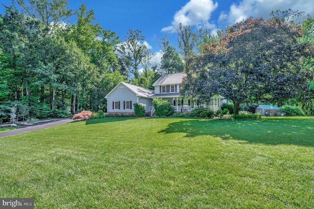 10415 Shaw Dr, Spotsylvania, VA 22553 - view of front facade featuring a front yard and covered porch