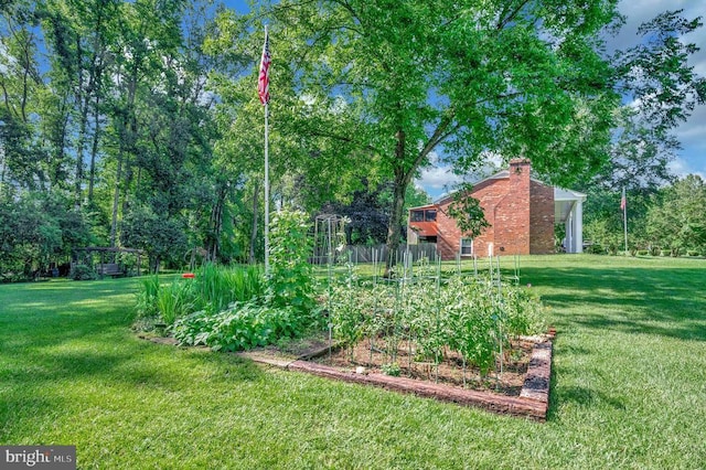 10415 Shaw Dr, Spotsylvania, VA 22553 - view of grassy yard with a vegetable garden