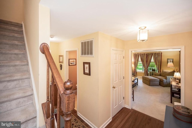 10415 Shaw Dr, Spotsylvania, VA 22553 - corridor featuring stairs and dark wood-style floors