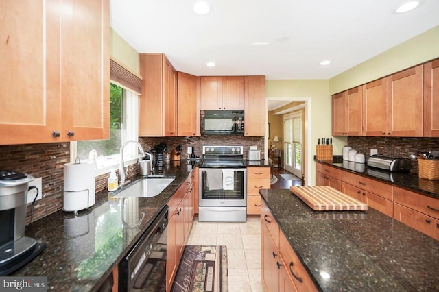 10415 Shaw Dr, Spotsylvania, VA 22553 - kitchen featuring black appliances, tasteful backsplash, dark stone countertops, and recessed lighting