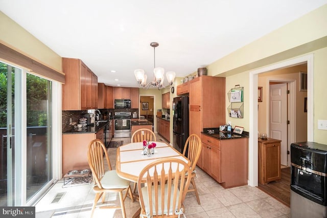 10415 Shaw Dr, Spotsylvania, VA 22553 - dining space featuring a chandelier, light tile patterned floors, and recessed lighting