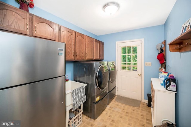 10415 Shaw Dr, Spotsylvania, VA 22553 - laundry area featuring separate washer and dryer and cabinet space
