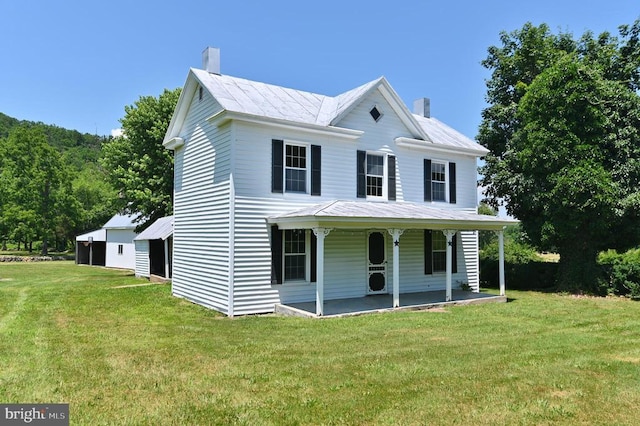 3150 Ida Rd, Luray, VA 22835 - view of front facade featuring a chimney, a front yard, a porch, a metal roof, and a garage