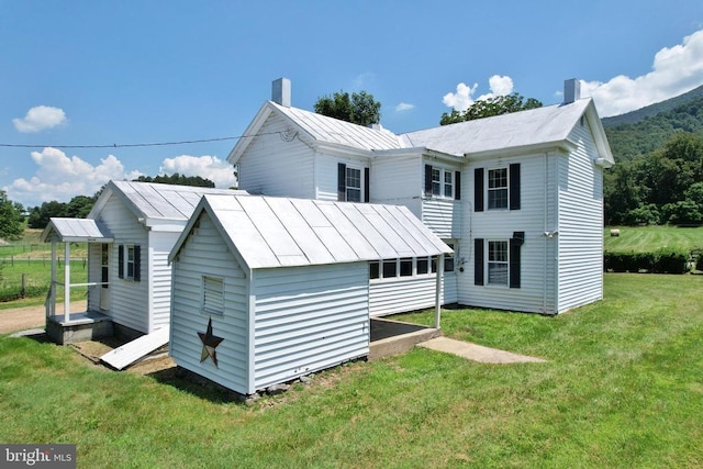 3150 Ida Rd, Luray, VA 22835 - back of property with a lawn and a chimney