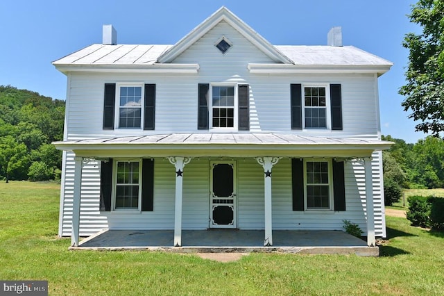 3150 Ida Rd, Luray, VA 22835 - view of front facade with a chimney, a front yard, covered porch, a standing seam roof, and a metal roof