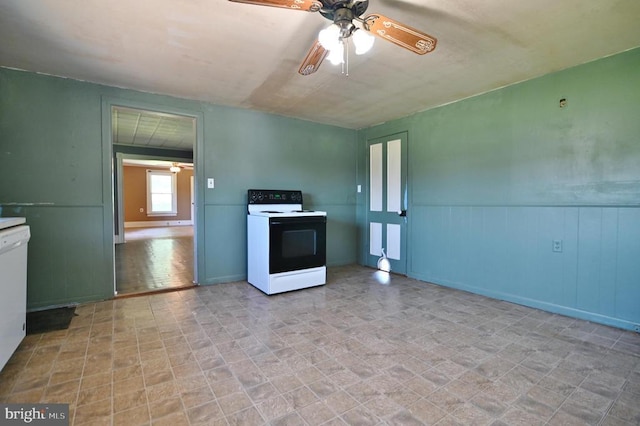 3150 Ida Rd, Luray, VA 22835 - kitchen with electric stove, ceiling fan, wainscoting, and white dishwasher