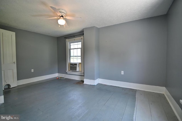 3150 Ida Rd, Luray, VA 22835 - unfurnished room with a textured ceiling, cooling unit, ceiling fan, and dark wood-style floors
