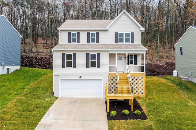 front of property with a porch, a garage, and a front lawn