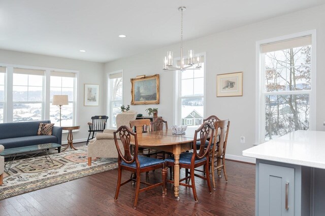 dining room with a chandelier and dark hardwood / wood-style flooring