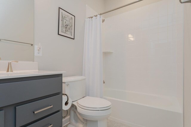 full bathroom with vanity, toilet, tile patterned flooring, and shower / tub combo