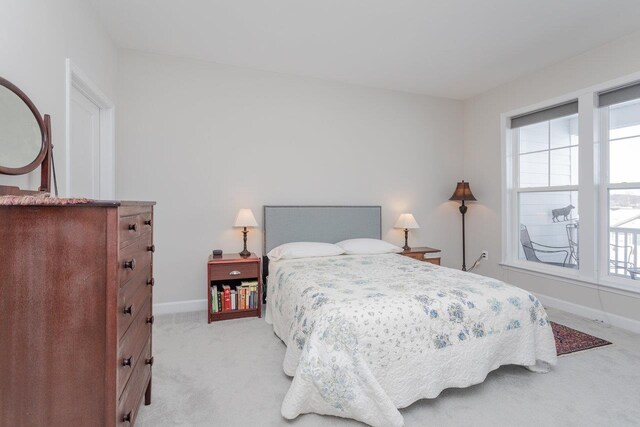 bedroom with light colored carpet