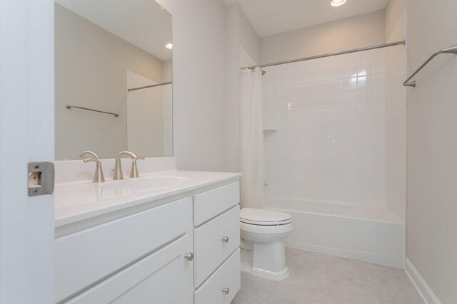 full bathroom with tile patterned flooring, vanity, shower / bath combo, and toilet