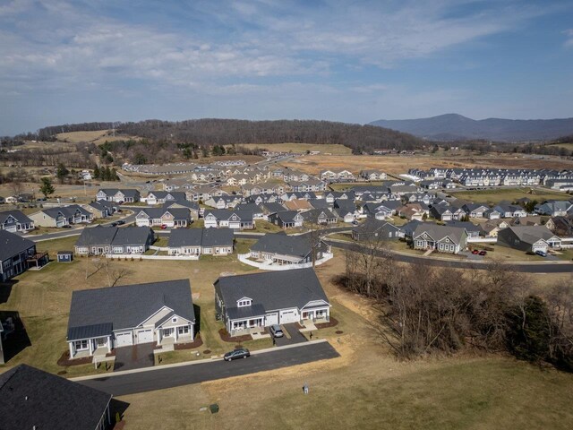 snowy aerial view featuring a mountain view