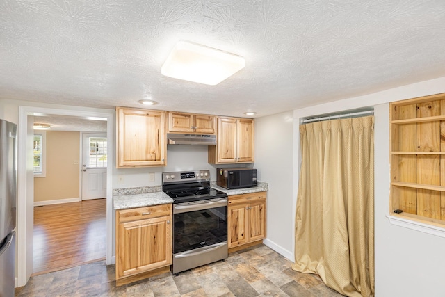 406 6th St, Luray, VA 22835 - kitchen featuring stainless steel appliances, under cabinet range hood, a textured ceiling, baseboards, and light brown cabinets