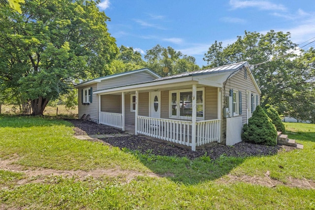 3416 Point Rd E, Elkton, VA 22827 - view of front of home with covered porch, a front lawn, and a metal roof