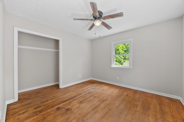 3416 Point Rd E, Elkton, VA 22827 - unfurnished bedroom with wood finished floors, a closet, and a ceiling fan