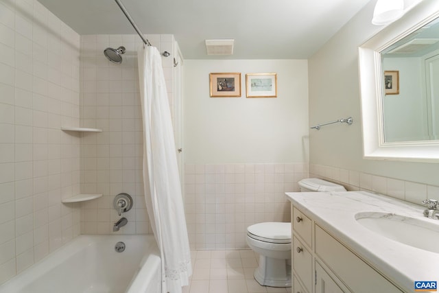 353 Bloomfield Rd, Charlottesville, VA 22901 - bathroom with tile walls, toilet, shower / bath combo with shower curtain, vanity, and tile patterned floors