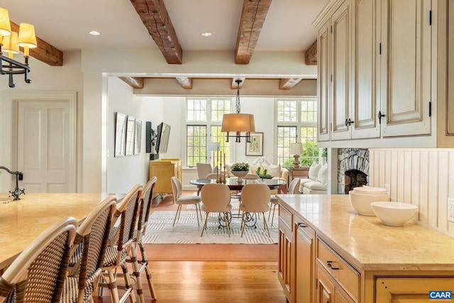 353 Bloomfield Rd, Charlottesville, VA 22901 - kitchen featuring light wood-style flooring, beamed ceiling, a fireplace, recessed lighting, and light stone countertops