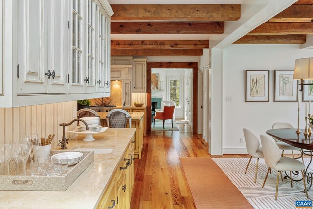 353 Bloomfield Rd, Charlottesville, VA 22901 - kitchen with light wood-style flooring, beam ceiling, and a sink