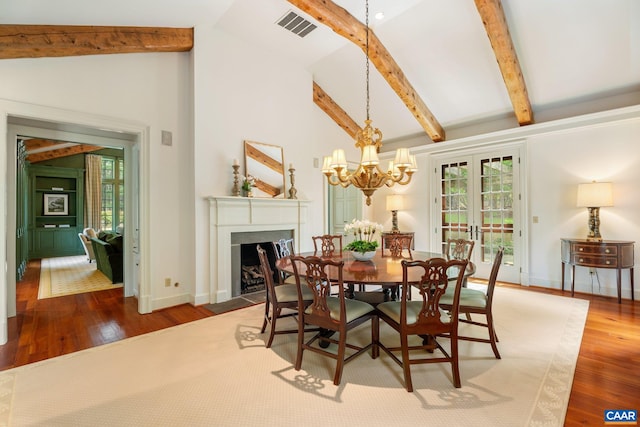 353 Bloomfield Rd, Charlottesville, VA 22901 - dining space with a fireplace with flush hearth, wood finished floors, beam ceiling, a chandelier, and baseboards
