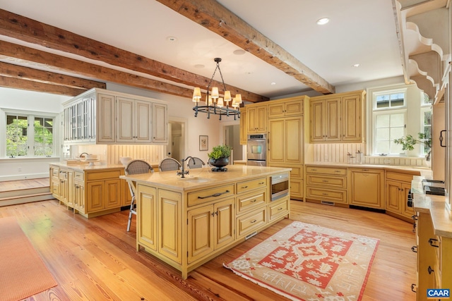 353 Bloomfield Rd, Charlottesville, VA 22901 - kitchen with stainless steel microwave, a sink, light wood-style flooring, beamed ceiling, and recessed lighting