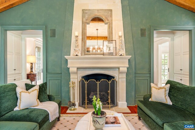 353 Bloomfield Rd, Charlottesville, VA 22901 - living room featuring wood finished floors, a chandelier, and a fireplace with flush hearth
