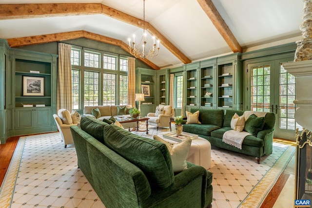 353 Bloomfield Rd, Charlottesville, VA 22901 - living room featuring healthy amount of natural light, a chandelier, wood finished floors, high vaulted ceiling, and french doors