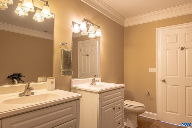 bathroom with two vanities, crown molding, and a sink