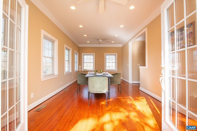dining room featuring crown molding, a ceiling fan, visible vents, and recessed lighting