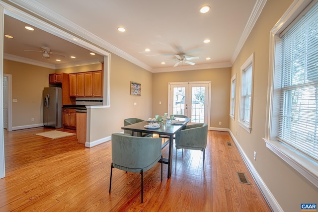 dining room with recessed lighting, baseboards, ornamental molding, ceiling fan, and light wood-type flooring