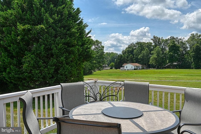 6905 Lakes Edge Way, Mineral, VA 23117 - wooden deck with outdoor dining space and a yard