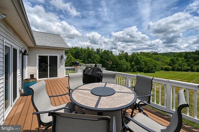 6905 Lakes Edge Way, Mineral, VA 23117 - deck featuring outdoor dining area and a view of trees